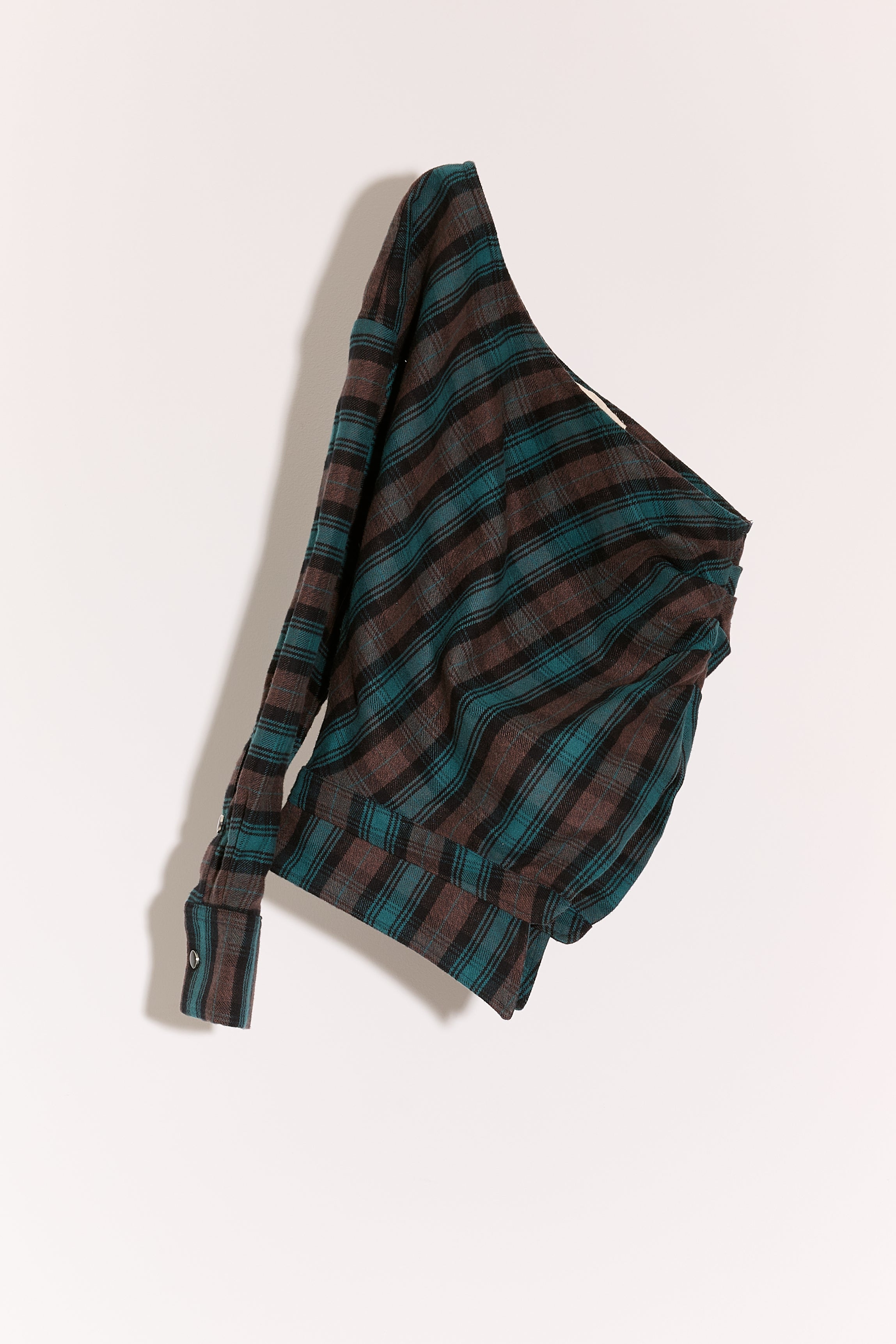 La Camisa de Lado